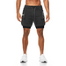 Short sport homme ECET noir – porté de face, maintien optimal, design moderne et poches fonctionnelles.