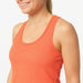 Zoom sur le tissu côtelé du débardeur sport femme orange, matière douce et respirante