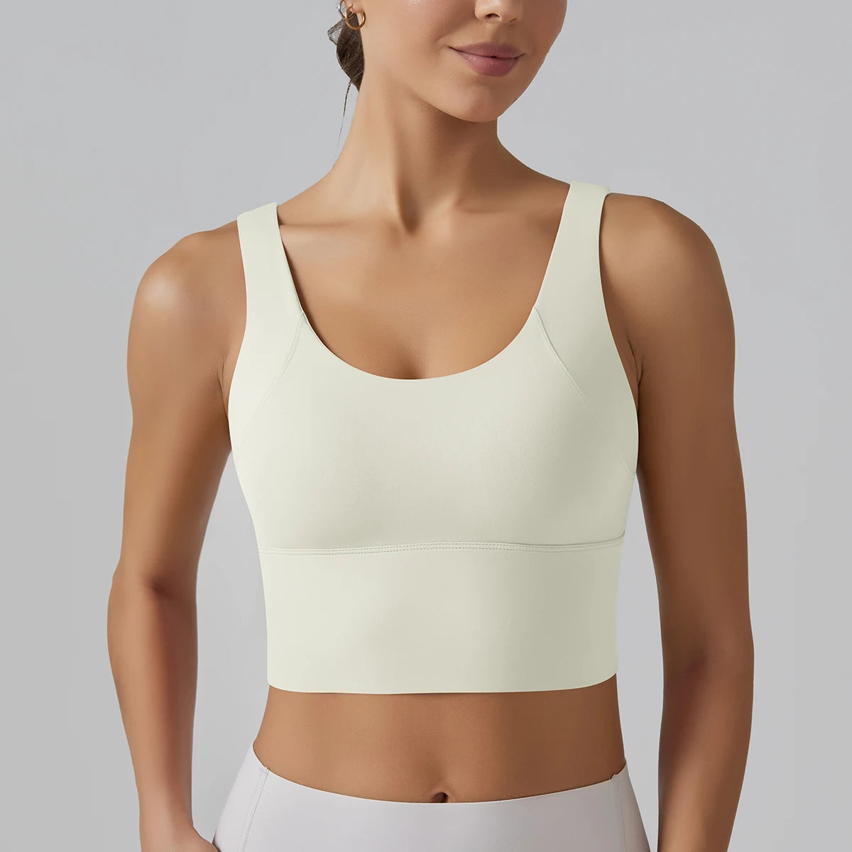 Débardeur sport femme Moonlight Ivory, maintien gainant et tissu respirant, vue de face.