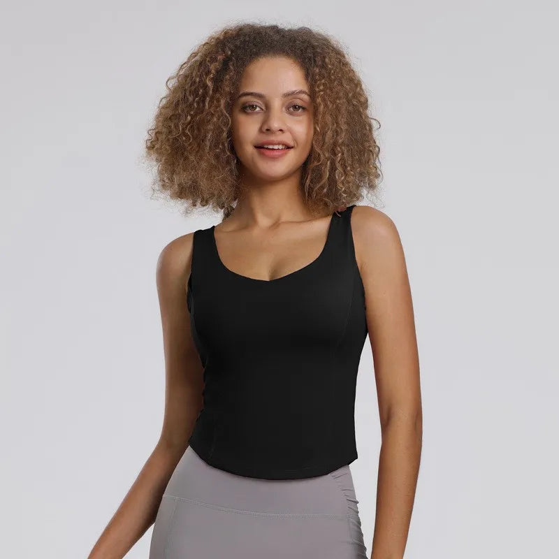 Débardeur sport femme noir performance, tissu gainant et respirant avec brassière intégrée, idéal fitness, yoga et running.