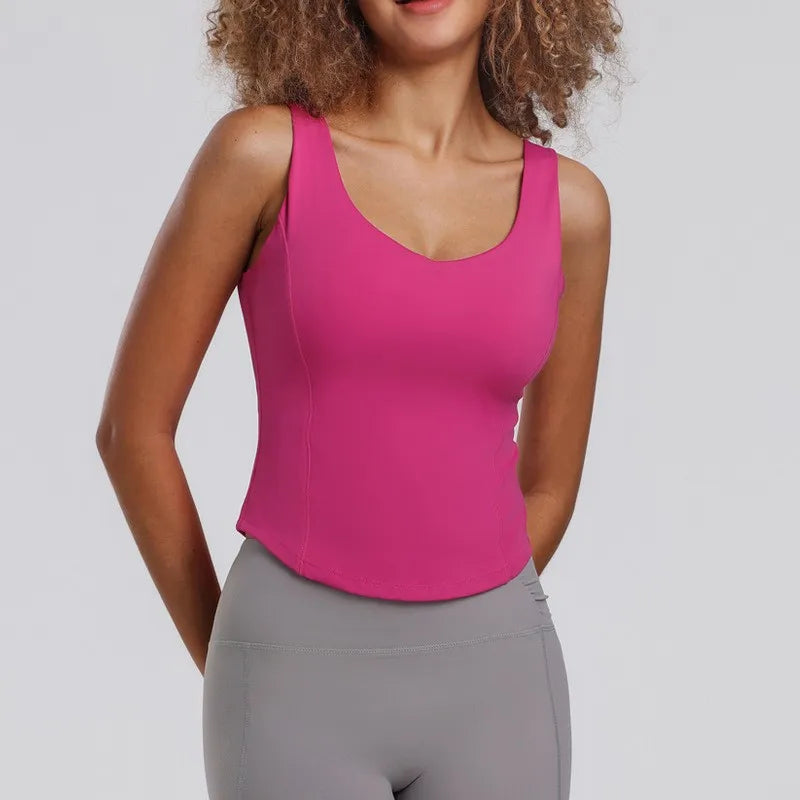 Débardeur sport femme rose énergie, maintien dynamique et tissu respirant, idéal fitness et entraînements intenses.
