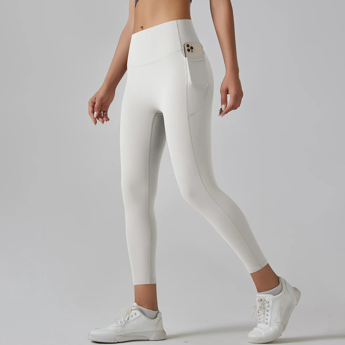  Legging de sport femme blanc ivoire taille haute vue de profil avec coupe ajustée