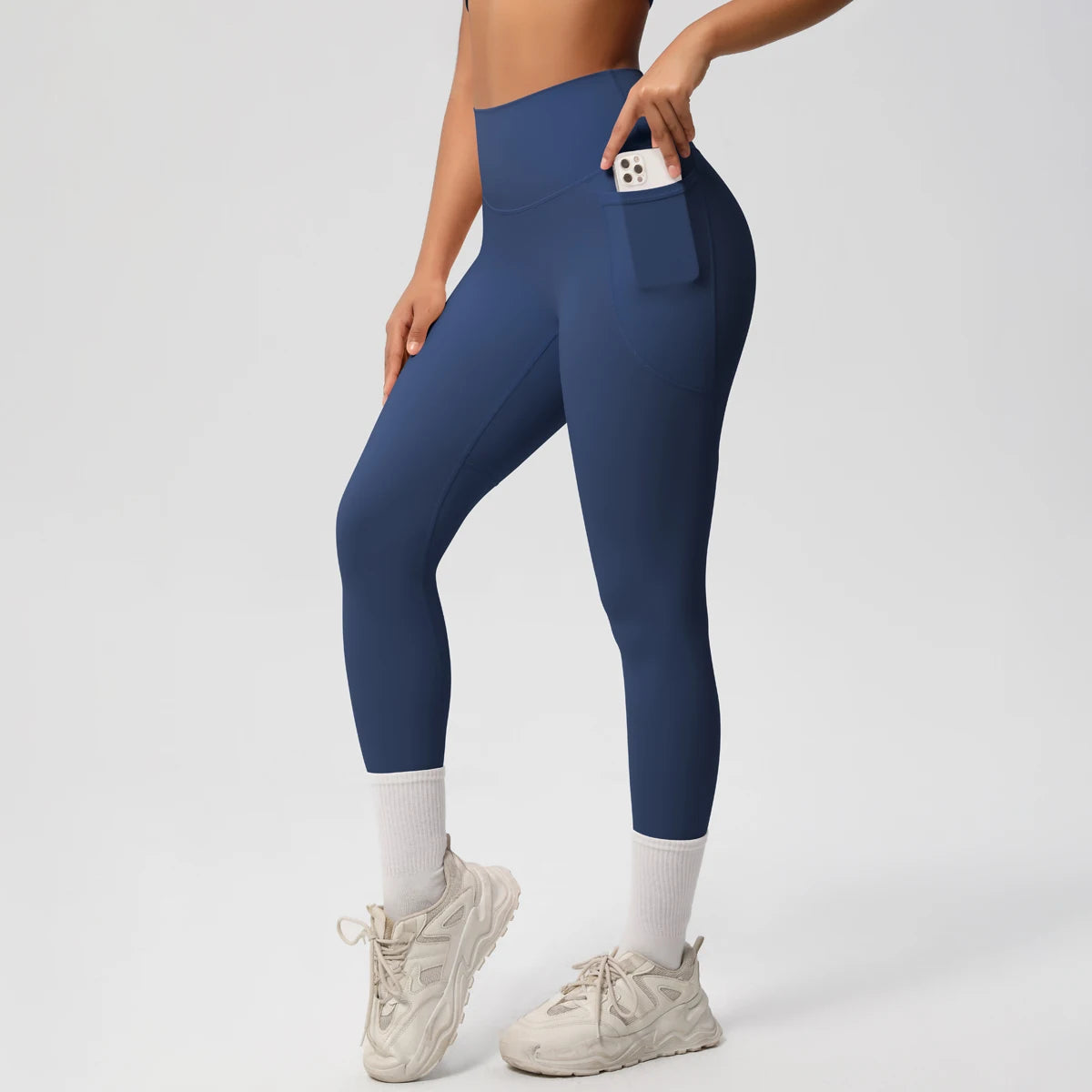 Legging de sport femme bleu marine taille haute vue de profil avec coupe ajustée
