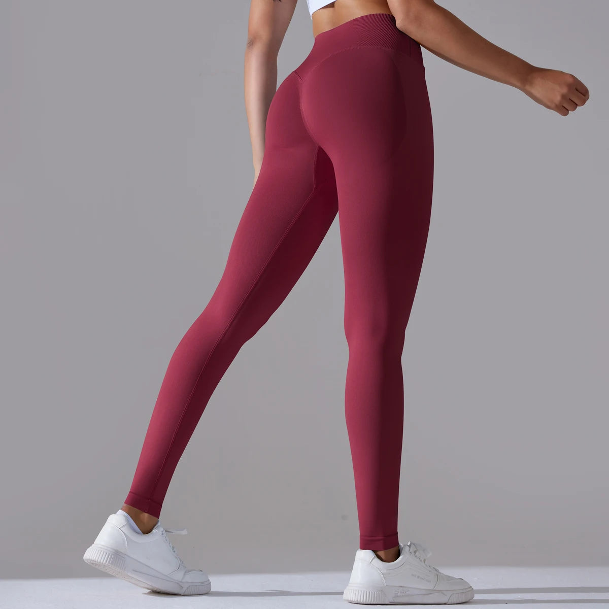 Legging de sport femme bordeaux extensible vue de profil pour entraînement et fitness
