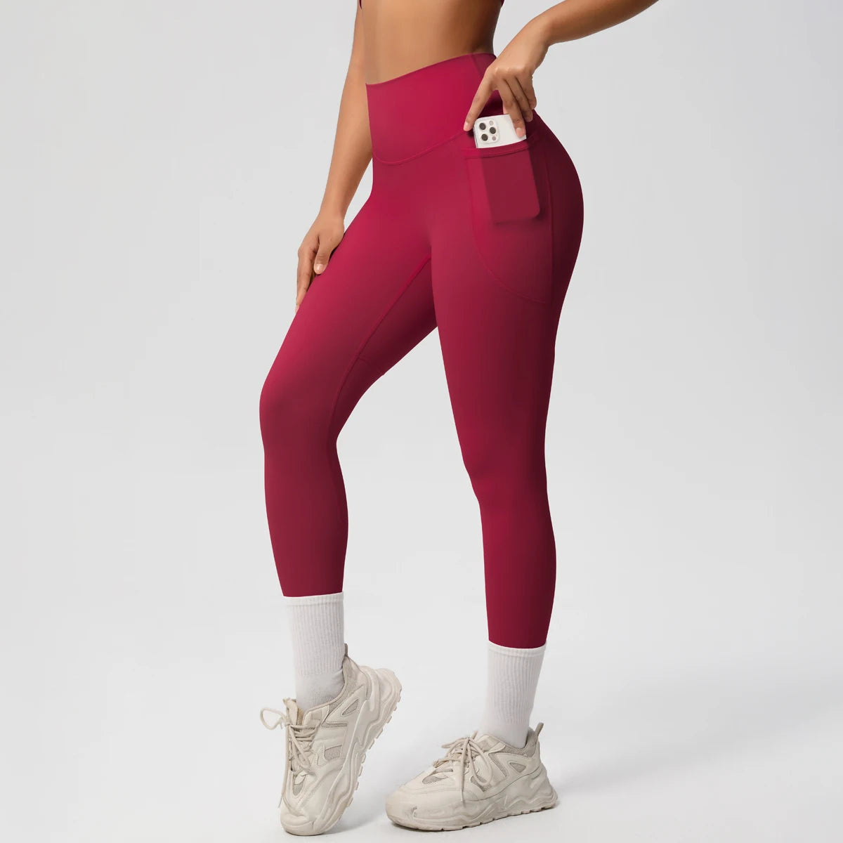 Legging de sport femme bordeaux taille haute avec coupe ajustée et maintien confortable
