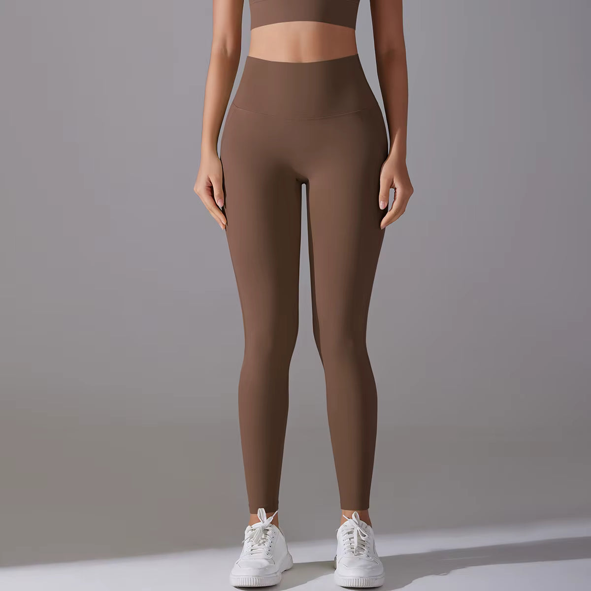 Legging de sport femme marron chocolat taille haute avec coupe ajustée et maintien confortable
