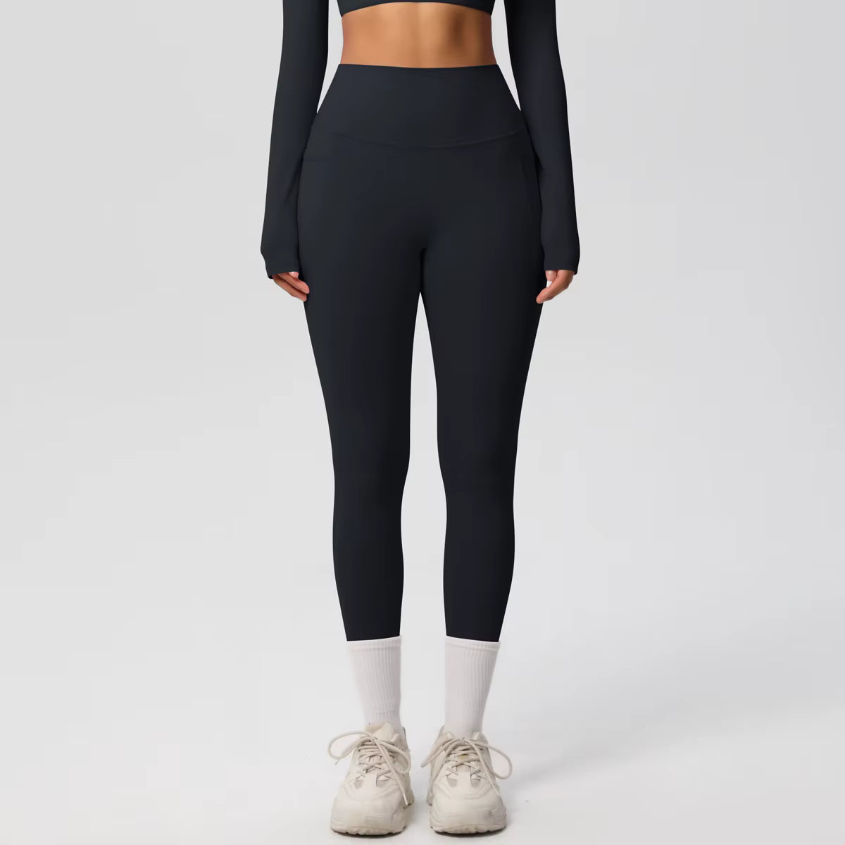 Legging de sport femme noir taille haute avec coupe ajustée et maintien confortable
