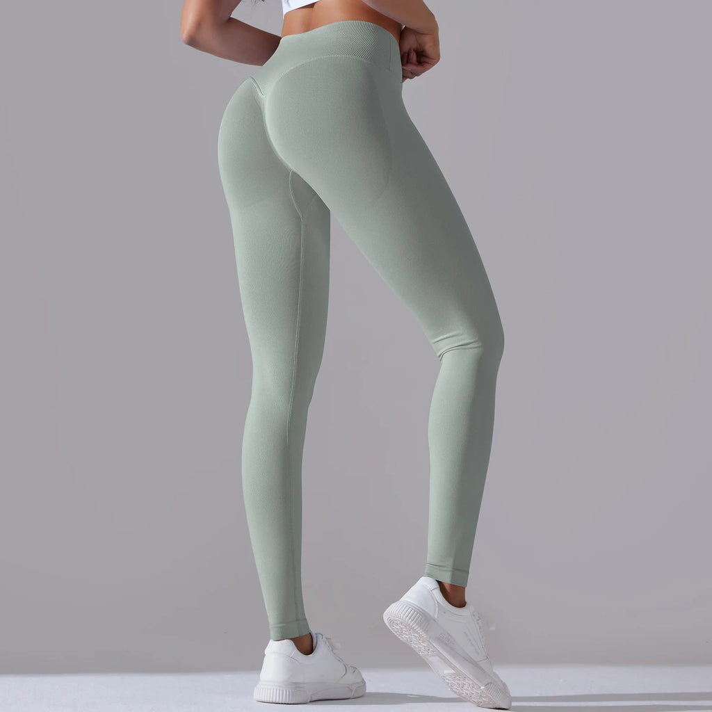 Legging de sport femme vert sauge clair vue arrière avec effet galbant
