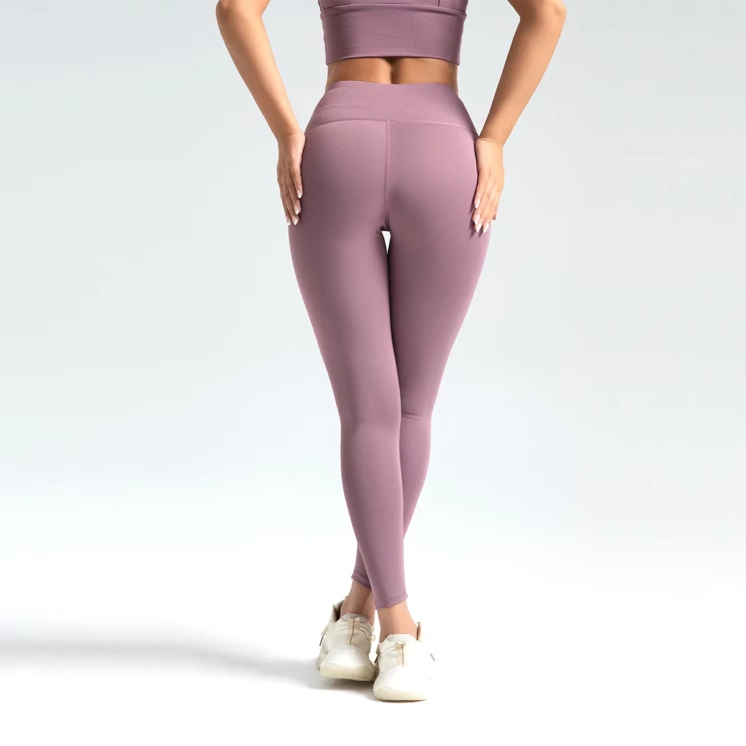 Legging de sport femme violet mauve taille haute vue profil silhouette affinée
