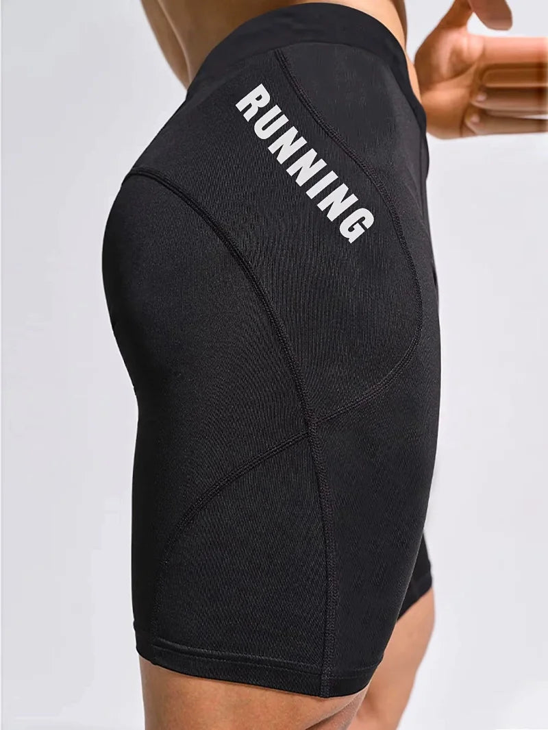 Cuissard running homme noir en polyester technique vue profil, maintien cuisses et évacuation transpiration