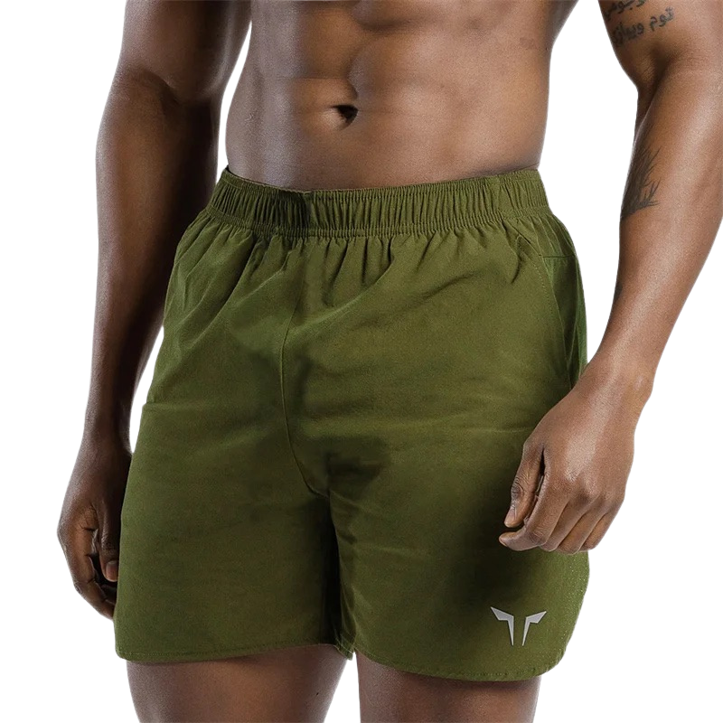 Zoom sur la taille élastique d’un short de sport vert pour homme – maintien et confort optimal
