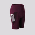 Détail poche latérale short de sport femme taille haute bordeaux pour smartphone, fitness et yoga