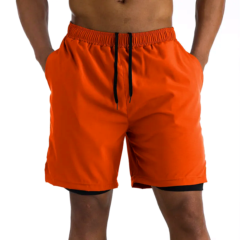 Short de sport homme 2-en-1 orange avec doublure noire et cordon ajustable, idéal pour running, musculation et entraînements intenses