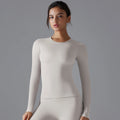T-shirt de sport femme manches longues gainant couleur cacao, tissu extensible respirant pour fitness yoga et entraînement