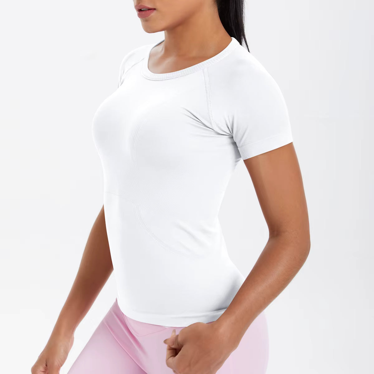 T-shirt de sport femme blanc, tissu stretch respirant, idéal musculation et fitness