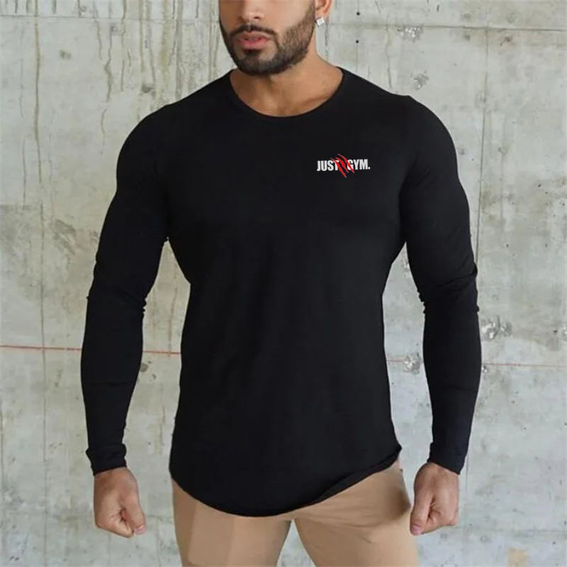 T-shirt de sport homme manches longues noir, coupe ajustée, tissu respirant pour fitness et musculation